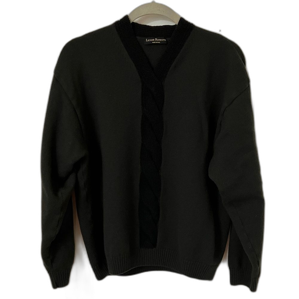 Black sweater with cable-knit embellishment